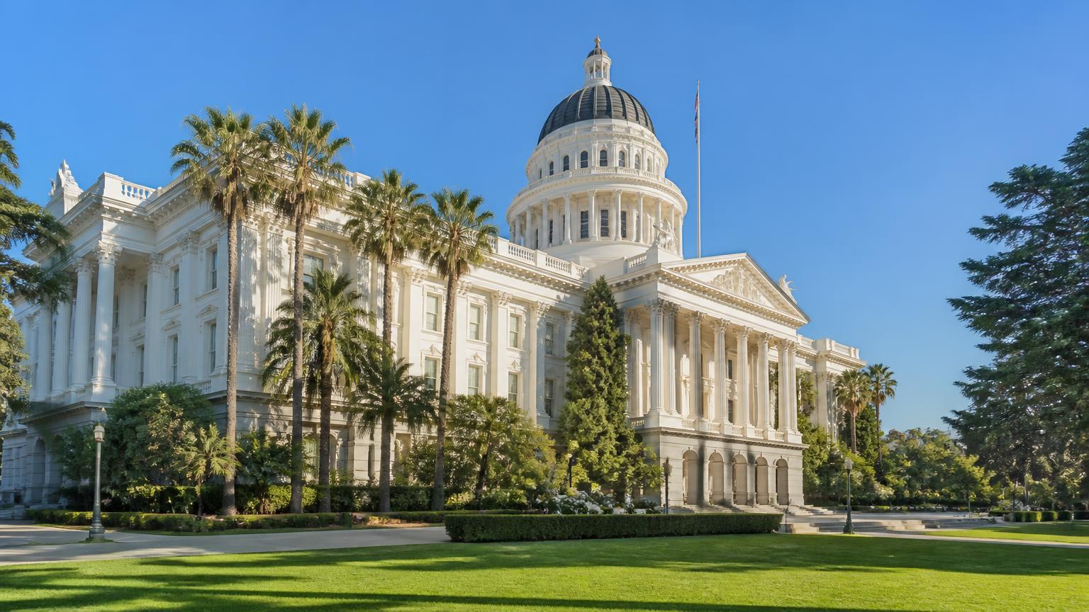California State Capitol, Capitol Park — 38.5767, -121.4934 California State Capitol dome and Capitol Park palm trees in Sacramento, civic landmark inside the 50-mile security guard vendor service radius